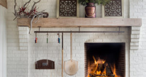 Holiday themed mantle with accompanying fireplace